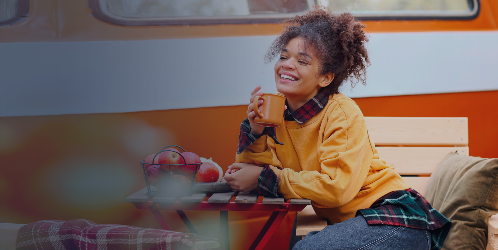 woman in fall sweater with logoed mug