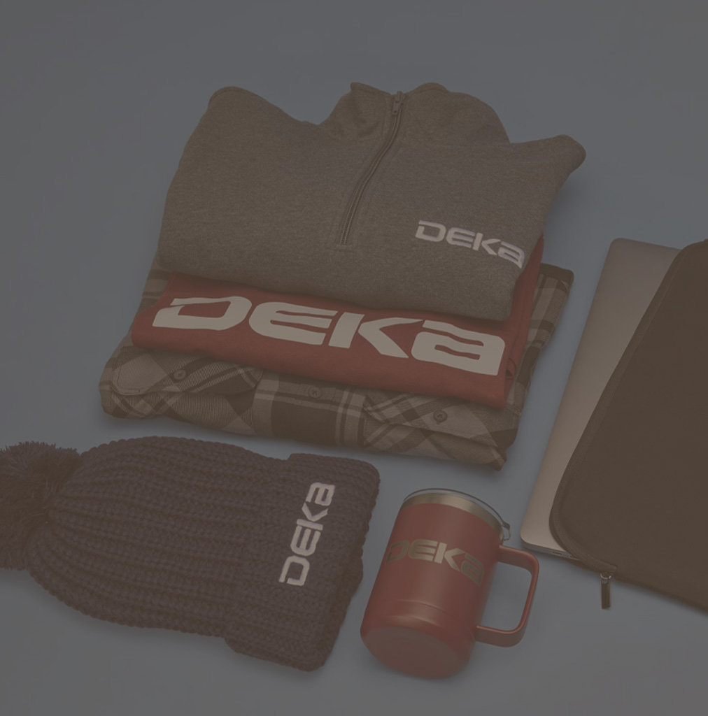 table with logoed tshirt, coffee mug and beanie hat