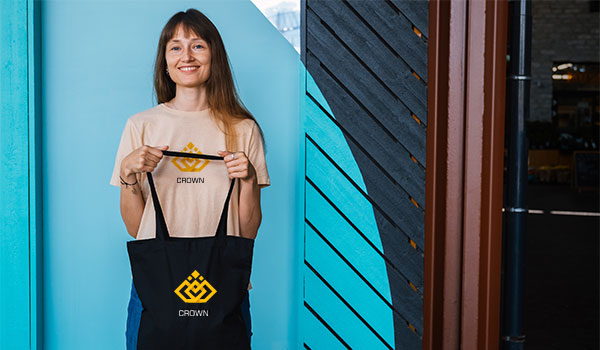woman holding bag and wearing a tshirt
