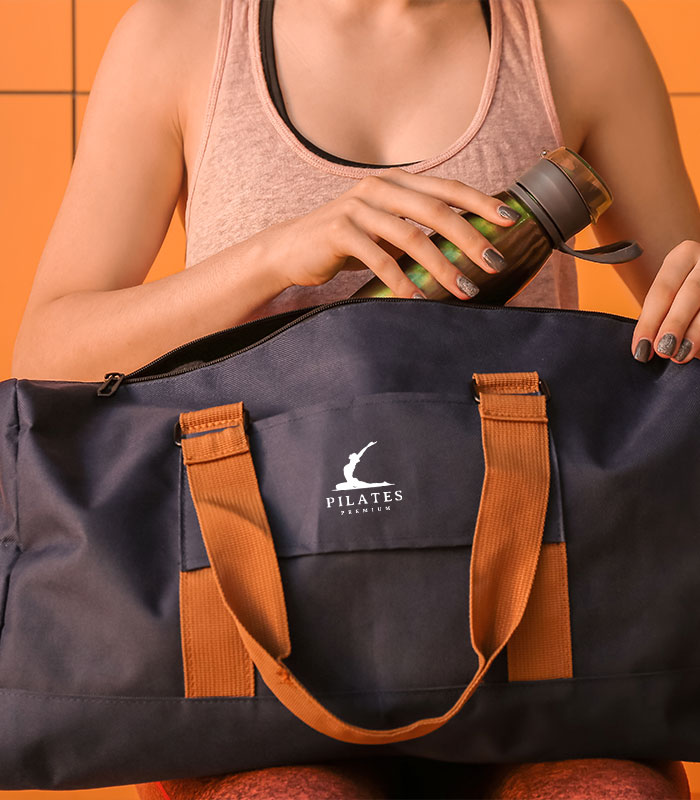 woman carrying a black gym bag