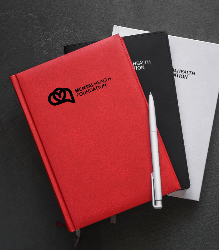 red, black and white notebooks