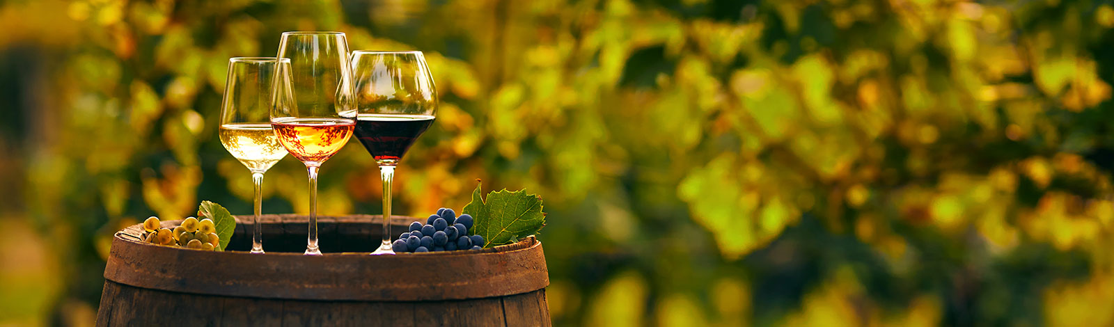 wine glasses on a wine barrel