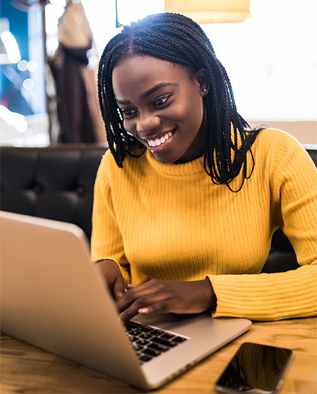 happy female customer service tech on computer