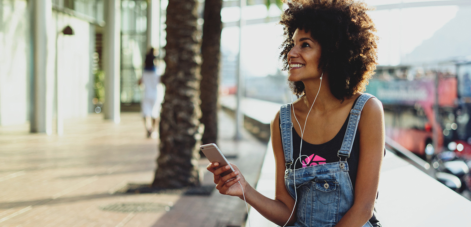 woman listening to music with earbuds